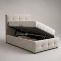 Lit coffre rembourré beige clair avec sommier relevable en acier, couchage 160 × 200 cm, dimensions 218 × 178 × 112 cm